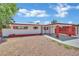 Charming single-story home featuring a carport, fresh exterior paint, and a secure gated front yard at 2016 Linden Ave, Las Vegas, NV 89101