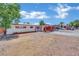 Charming single-story home featuring a carport, fresh exterior paint, and a secure gated front yard at 2016 Linden Ave, Las Vegas, NV 89101