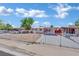 Charming single-story home featuring a carport, fresh exterior paint, and a secure gated front yard at 2016 Linden Ave, Las Vegas, NV 89101