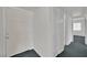 Hallway with multiple doors and light gray carpets at 2016 Linden Ave, Las Vegas, NV 89101