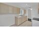 Well-lit kitchen with modern appliances, neutral cabinets, and wood-look flooring at 2016 Linden Ave, Las Vegas, NV 89101