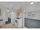 Bright kitchen featuring white appliances, neutral cabinets, and an open view into adjacent living area at 2016 Linden Ave, Las Vegas, NV 89101