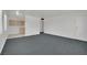 Spacious living room with carpet, connecting to kitchen and entryway at 2016 Linden Ave, Las Vegas, NV 89101