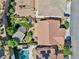 A bird's-eye view of a home showcasing the backyard, patio area, and roof at 2189 De Narvik Dr, Henderson, NV 89044