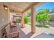 Inviting backyard with a covered patio, bench seating, outdoor grill, and professionally landscaped at 2189 De Narvik Dr, Henderson, NV 89044