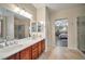 Spacious primary bathroom features dual sinks, a soaking tub, and a separate shower at 2189 De Narvik Dr, Henderson, NV 89044