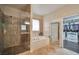 Well-lit bathroom features a walk-in shower, garden tub, and a spacious walk-in closet at 2189 De Narvik Dr, Henderson, NV 89044