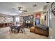 Open concept dining room with tile floors, modern lighting, and a large display cabinet at 2189 De Narvik Dr, Henderson, NV 89044