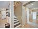 Hallway view featuring tile floors, a staircase, and multiple access points at 2189 De Narvik Dr, Henderson, NV 89044