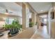 Bright hallway featuring decorative wall cut-outs with potted plants at 2189 De Narvik Dr, Henderson, NV 89044