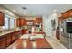 Spacious kitchen featuring stainless steel appliances, ample counter space, and a cozy dining area at 2189 De Narvik Dr, Henderson, NV 89044