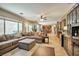 Spacious living room boasts abundant natural light, tile flooring, and comfortable seating at 2189 De Narvik Dr, Henderson, NV 89044
