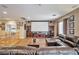 Upstairs living room with movie screen and comfortable, oversized leather sofa at 2189 De Narvik Dr, Henderson, NV 89044