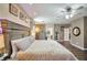 Another view of main bedroom with light-colored wood floors, modern furniture, and relaxing ambiance at 2189 De Narvik Dr, Henderson, NV 89044