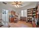 Bright home office featuring a large desk, built-in shelves, and organized closet space at 2189 De Narvik Dr, Henderson, NV 89044