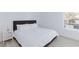Bedroom features white bedding, side tables and a window with blinds at 2300 E Silverado Ranch Blvd # 1165, Las Vegas, NV 89183