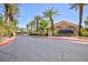 The community entrance is highlighted with mature palm trees and a decorative sign at 2300 E Silverado Ranch Blvd # 1165, Las Vegas, NV 89183