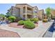Attractive apartment building with well-manicured landscaping and inviting walkways on a sunny day at 2300 E Silverado Ranch Blvd # 1165, Las Vegas, NV 89183