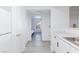 Bright white kitchen with stainless steel sink and black hardware at 2300 E Silverado Ranch Blvd # 1165, Las Vegas, NV 89183