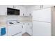 Efficient kitchen layout with modern appliances, white cabinets, and ample storage space at 2300 E Silverado Ranch Blvd # 1165, Las Vegas, NV 89183