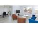 Bright living room with modern furniture, sleek floors, and a cozy dining area at 2300 E Silverado Ranch Blvd # 1165, Las Vegas, NV 89183