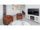 Bright open concept living room with contemporary furniture and a view of the dining area at 2300 E Silverado Ranch Blvd # 1165, Las Vegas, NV 89183