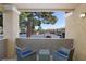 Cozy covered patio offers tranquil outdoor living space with seating and a view of the parking area at 2300 E Silverado Ranch Blvd # 1165, Las Vegas, NV 89183