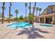 Resort-style pool area with towering palm trees and comfortable seating, perfect for relaxation at 2300 E Silverado Ranch Blvd # 1165, Las Vegas, NV 89183