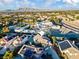 Expansive aerial view of the home showcasing its setting within a vibrant Las Vegas community near scenic mountains at 2639 Regency Cove Ct, Las Vegas, NV 89121