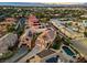 Sunset aerial view of the home's setting within a neighborhood, showing nearby homes and landscaping at 2639 Regency Cove Ct, Las Vegas, NV 89121