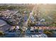 Expansive aerial view of a vibrant community, showcasing tree-lined streets and various single Gathering homes at 2639 Regency Cove Ct, Las Vegas, NV 89121