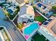 Aerial view of the home showcasing a backyard pool, patio, manicured lawn and landscaping at 2639 Regency Cove Ct, Las Vegas, NV 89121