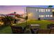 Inviting backyard features a lush lawn, pool, and comfortable seating, perfect for outdoor relaxation and entertaining at 2639 Regency Cove Ct, Las Vegas, NV 89121
