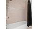 Bathroom shower and tub combination with a tan tile surround at 2639 Regency Cove Ct, Las Vegas, NV 89121