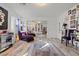 Bedroom with wall art, mirrored closet doors, and purple chaise lounge at 2639 Regency Cove Ct, Las Vegas, NV 89121