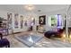 Unique bedroom with a chaise lounge, wall art, and modern decor at 2639 Regency Cove Ct, Las Vegas, NV 89121