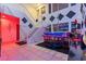 Grand entryway with a piano, statement wall decor, and modern lighting at 2639 Regency Cove Ct, Las Vegas, NV 89121