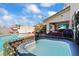 Backyard featuring a sparkling pool and a hot tub, perfect for outdoor relaxation and entertainment at 2639 Regency Cove Ct, Las Vegas, NV 89121