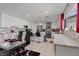 White eat-in kitchen featuring modern appliances and eat-in bar at 2639 Regency Cove Ct, Las Vegas, NV 89121