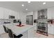 Updated kitchen features white cabinets, mosaic tile backsplash, and stainless steel appliances at 2639 Regency Cove Ct, Las Vegas, NV 89121