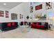 Open-concept living room with high ceilings, modern decor, and tile flooring at 2639 Regency Cove Ct, Las Vegas, NV 89121
