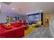 Spacious living room with a movie screen, modern furniture, and bright colors at 2639 Regency Cove Ct, Las Vegas, NV 89121