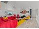 Large living room with a sectional, accent chair, and a mounted projector at 2639 Regency Cove Ct, Las Vegas, NV 89121
