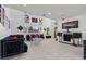 Open-concept living room with high ceilings, modern decor, and tile flooring at 2639 Regency Cove Ct, Las Vegas, NV 89121