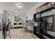 Home office with modern decor, built-in shelving, and seating area at 2639 Regency Cove Ct, Las Vegas, NV 89121