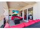 Relaxing outdoor patio with a TV, comfortable seating, and a mini fridge at 2639 Regency Cove Ct, Las Vegas, NV 89121