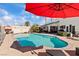 Sparkling in-ground pool surrounded by a patio, perfect for warm days, relaxation and entertaining at 2639 Regency Cove Ct, Las Vegas, NV 89121