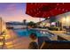 Beautiful in-ground pool with surrounding patio and outdoor seating, perfect for entertaining or relaxing at 2639 Regency Cove Ct, Las Vegas, NV 89121