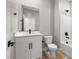 Bathroom with a white vanity, modern black fixtures, and a shower-tub combination, creating a fresh feel at 3224 Lahontan St, North Las Vegas, NV 89032