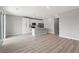 Bright, open-concept kitchen featuring white cabinets, stainless appliances, and a center island with a breakfast bar at 3224 Lahontan St, North Las Vegas, NV 89032